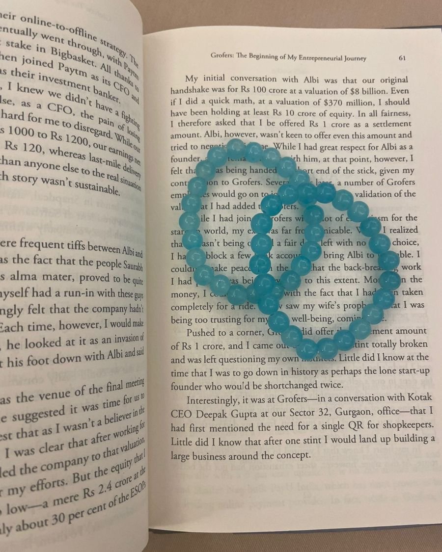 Blue beaded bracelets on an open book